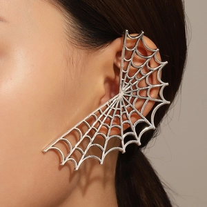 Detail shot of a silver spider web ear cuff wrap for women in a punk gothic style