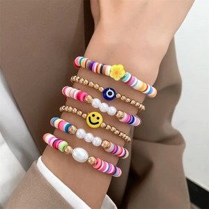 Close-up of 6pcs colorful polymer clay bead bracelets with smiley face and pearls on wrist