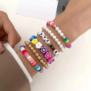 Detailed view of 6-piece summer beaded bracelet set with smiley faces and letters