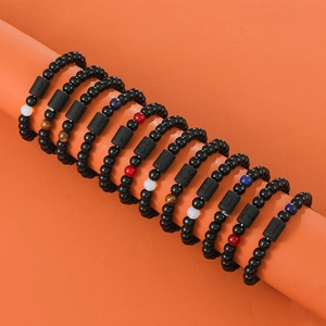Elastic zodiac bracelets set with black polished stones and engraved astrology symbols