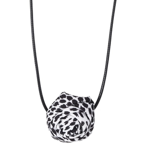 Detail of fabric rose pendant with leopard print pattern on a black wax cord necklace