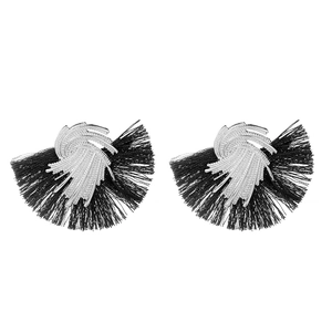 Detail of silver spiral design earrings with black fan-shaped fiber tassels for women