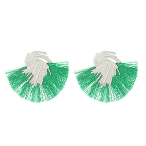 Detail of green silk fringe earrings with wavy silver metal accents and fanned texture