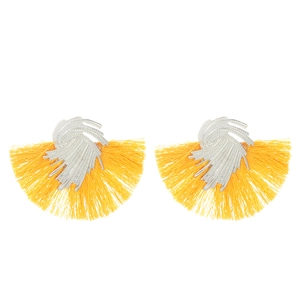 Detailed view of yellow tassel fan earrings with textured silver wavy metal accents