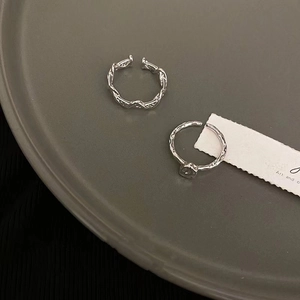 Minimalist irregular silver open ring set with twisted texture and geometric square detail