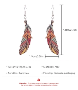 Detail view of Bohemian alloy feather earrings showing 7.3cm size and weight specs
