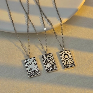 Retro tarot card necklaces set featuring star moon and sun pendants on silver chains