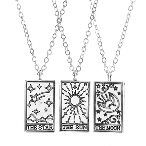 Vintage tarot card necklace set featuring silver Moon Sun and Star geometric pendants