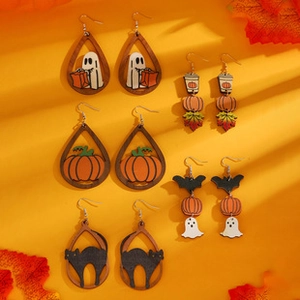 Detailed close-up of colorful Halloween ghost, pumpkin, and black cat dangle earrings