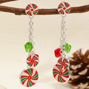 Christmas peppermint candy drop earrings with red and green crystals on tree branch