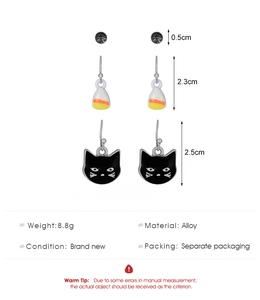 Three-pair Halloween earring set featuring black studs, striped drops and cat charms