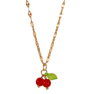 Close-up of cherry pendant necklace with red translucent beads and green leaf on gold chain