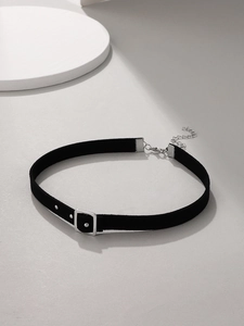 Detail view of black velvet choker featuring a silver rectangular buckle and adjustable chain
