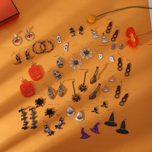 Halloween earring set featuring pumpkin skull and ghost designs on orange backdrop