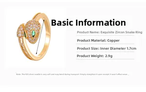 Detail view of gold snake ring with micro-pave cubic zirconia and green gem eyes