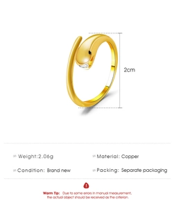 Detail view of gold snake ring with zircon stone, showing copper material and 2g weight