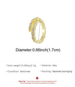 Macro detail of gold snake ring showing 1.7cm diameter and 2.7g weight specifications