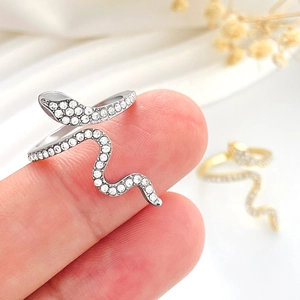 Detailed close-up of micro-set zircon snake rings in silver and gold plating
