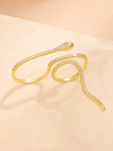 Close-up of golden snake ring featuring intricate crystal pavé and multi-wrap design