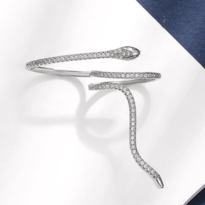 Silver snake wrap ring featuring micro-pave zircons and minimalist serpent design