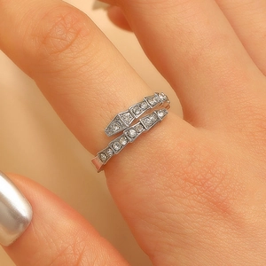 Macro shot of silver snake ring with cubic zirconia paving in a modular design