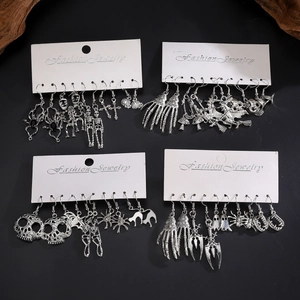 Five-piece silver Halloween earring set featuring skull, spider, and pumpkin motifs