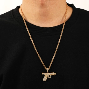 Hip hop gold pistol pendant necklace with sparkling cubic zirconia on twist chain