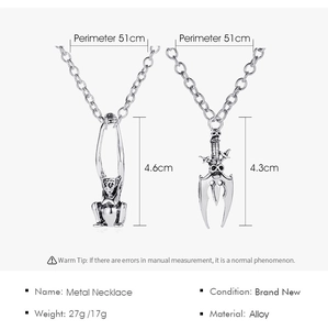 Detail showing Gothic skull sword and monkey pendants with vintage alloy finish