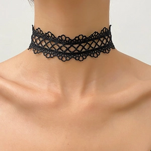 Detailed view of black lace choker with gothic rivets and wing pattern on neck