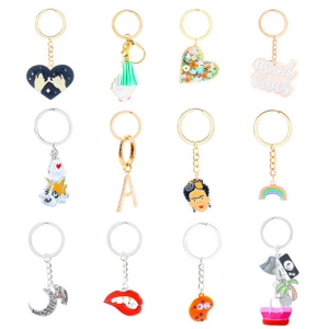 Detailed view of 12-piece enamel keychain set featuring rainbow and heart charms