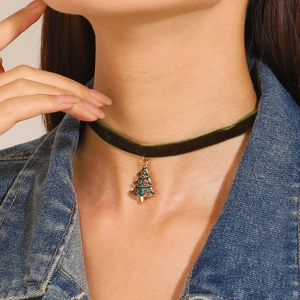 Detail of dark green velvet choker featuring a decorative Christmas tree pendant