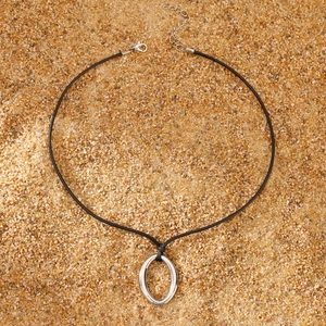 Minimalist silver oval pendant on black wax cord necklace with lobster clasp detail