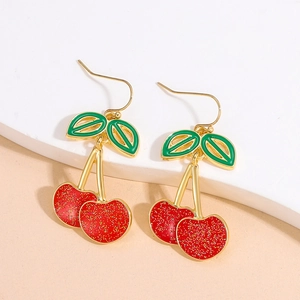 Cute red acrylic cherry drop earrings with gold glitter finish and green leaf detail
