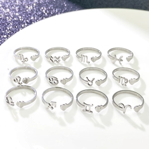 Set of 12 zodiac open rings in silver finish with heart charm and adjustable design