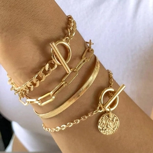 Golden 4-piece layered chain bracelet set with snake bone, OT buckle and coin pendant