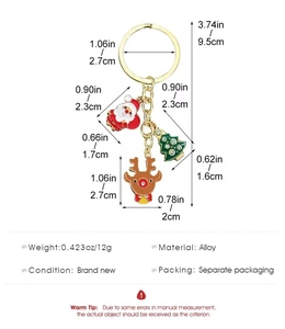 Detail view showing Christmas keychain dimensions with Santa Claus and reindeer charms