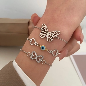 Three-piece silver evil eye bracelet set with butterfly and heart charms for women