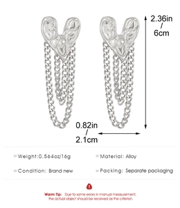 Detail view of silver heart earrings with fringe chains and precise size measurements