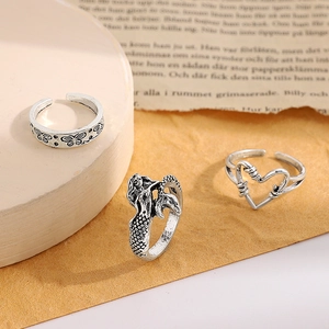 Retro silver ring set with butterfly, mermaid and heart motifs in vintage style
