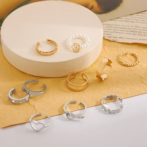 Vintage retro mixed ring set featuring butterfly and heart hollow designs in gold and silver