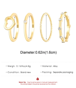 Detail view of 4-piece gold alloy ring set with heart cutout and woven texture info