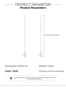 Detail view of 10.2cm long golden tassel chain drop earrings made of copper material