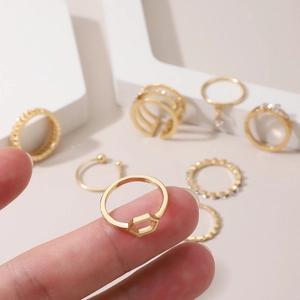 Detail view of gold alloy honeycomb open ring and stacked rhinestone set for women