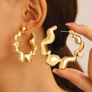 Minimalist golden wavy hoop earrings with liquid metal texture for women