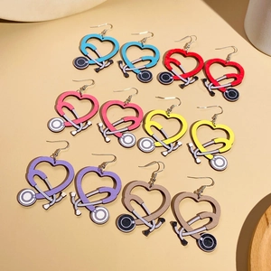 Close-up of heart stethoscope wooden earrings in blue, red, pink, yellow and purple hues