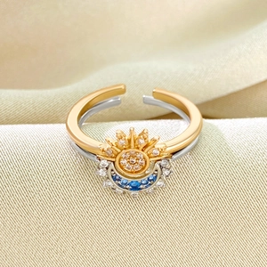 Macro shot of sun and moon open ring with shimmering cubic zirconia and dual-tone plating