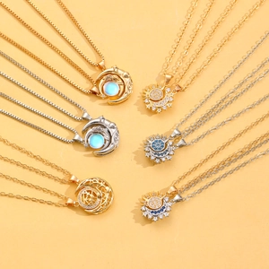 Magnetic sun and moon couple necklaces with celestial charms and glowing moonstone detail