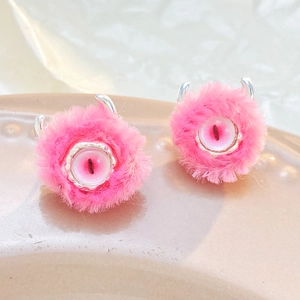 Pink furry monster eye rings featuring fluffy texture and silver metallic horns detail