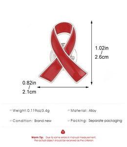 Detailed view of red ribbon enamel brooch showing dimensions 2.6cm by 2.1cm and weight