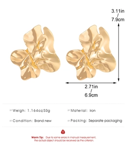 Detail showing large irregular gold metallic petal earrings with 7.9cm height specifications